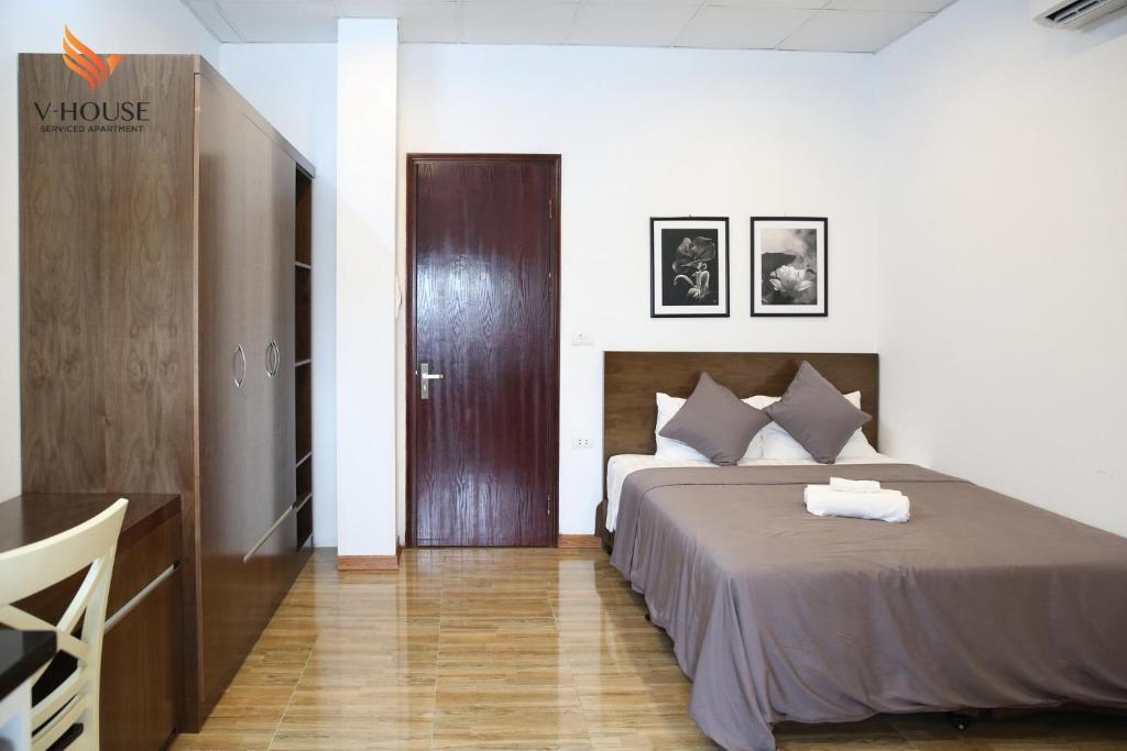 Postel nebo postele na pokoji v ubytování V House 5 Serviced Apartment