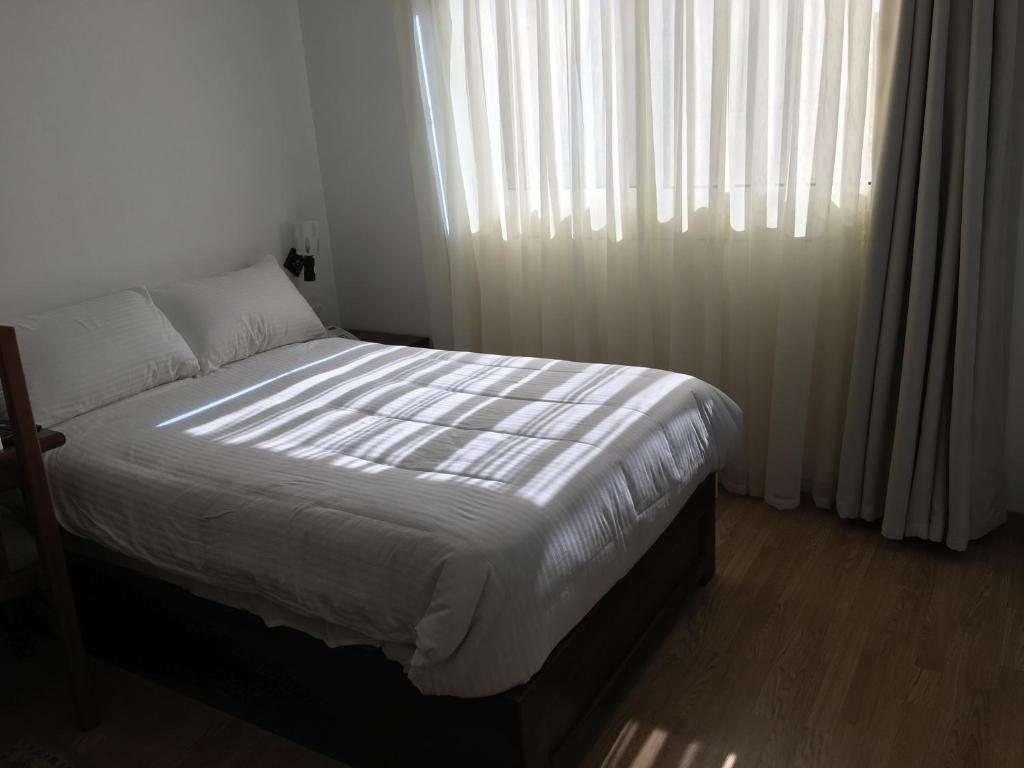 Postel nebo postele na pokoji v ubytování E-Just Hotel Borg El Arab