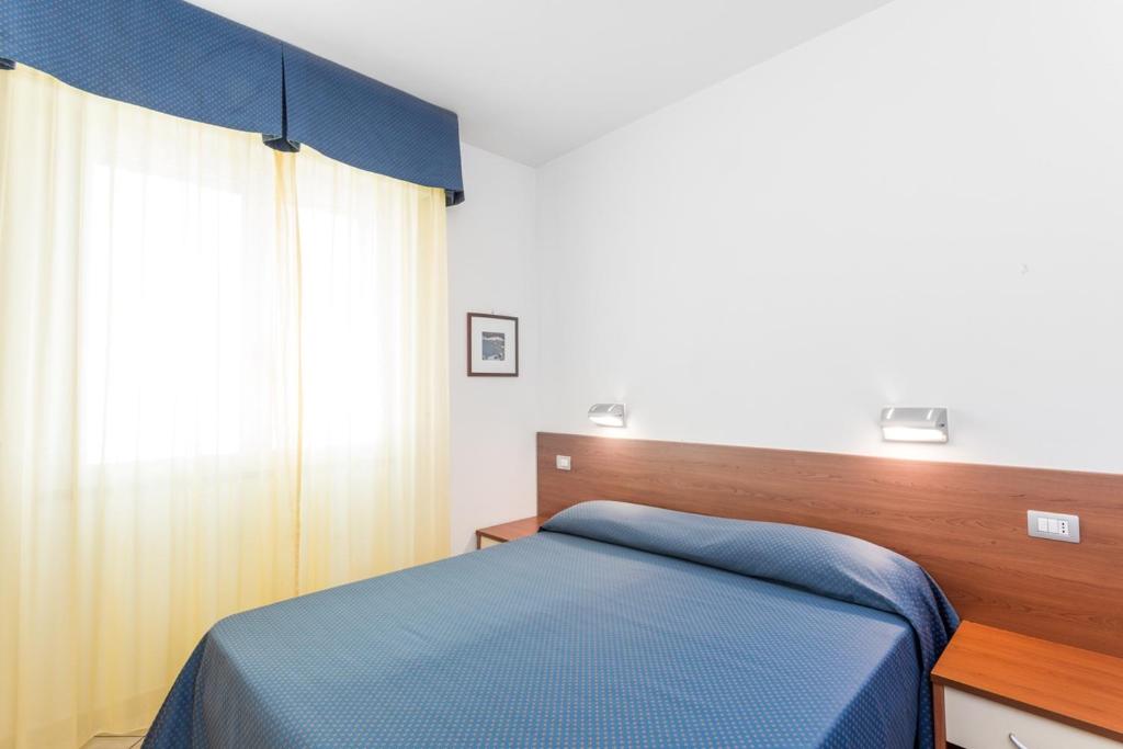 Posteľ alebo postele v izbe v ubytovaní Residence Sant'Anna
