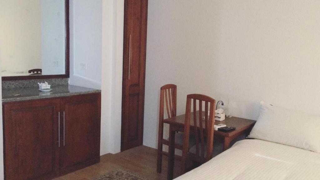 Postel nebo postele na pokoji v ubytování E-Just Hotel Borg El Arab