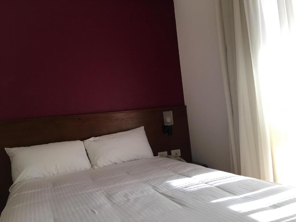 Postel nebo postele na pokoji v ubytování E-Just Hotel Borg El Arab