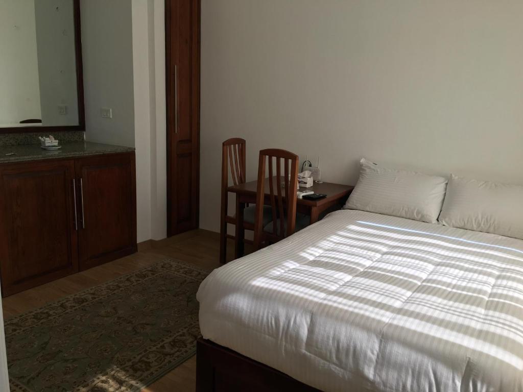 Postel nebo postele na pokoji v ubytování E-Just Hotel Borg El Arab