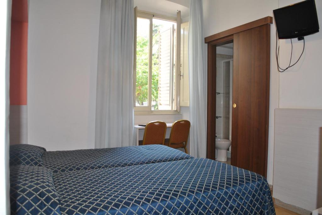Posteľ alebo postele v izbe v ubytovaní AUTO PARK Hotel
