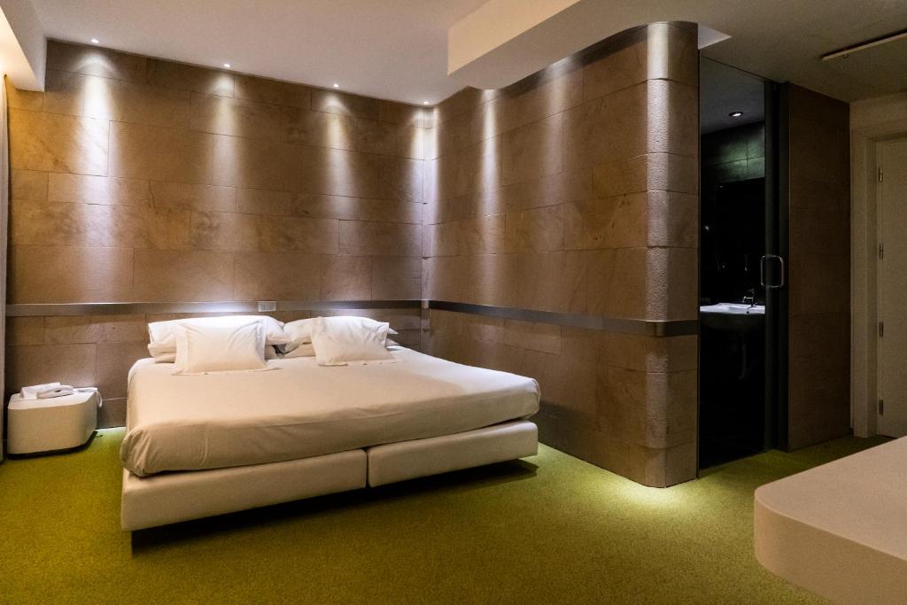 Postel nebo postele na pokoji v ubytování A Point Arezzo Park Hotel