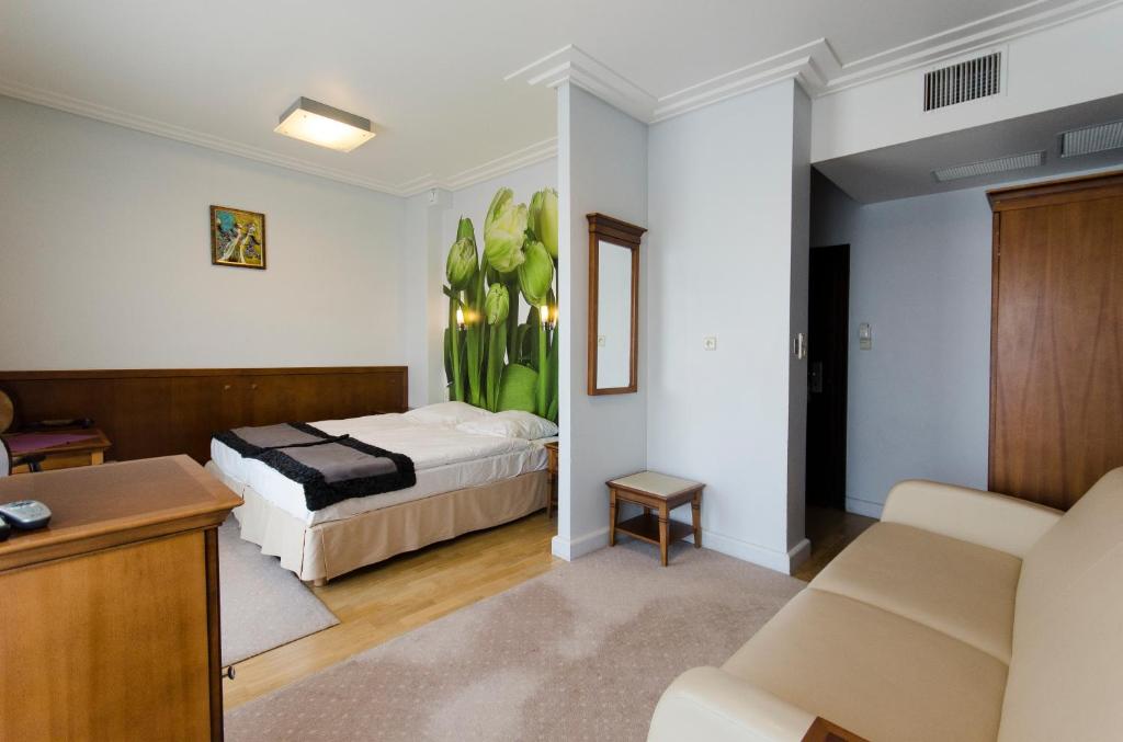 Postel nebo postele na pokoji v ubytování Hotel Apollo