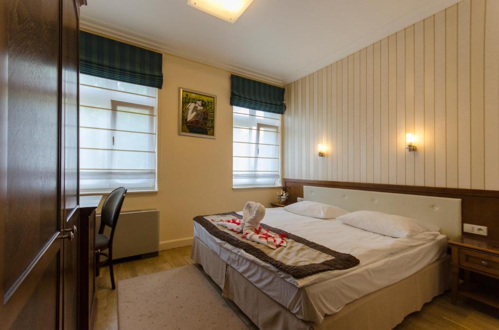 Postel nebo postele na pokoji v ubytování Hotel Apollo