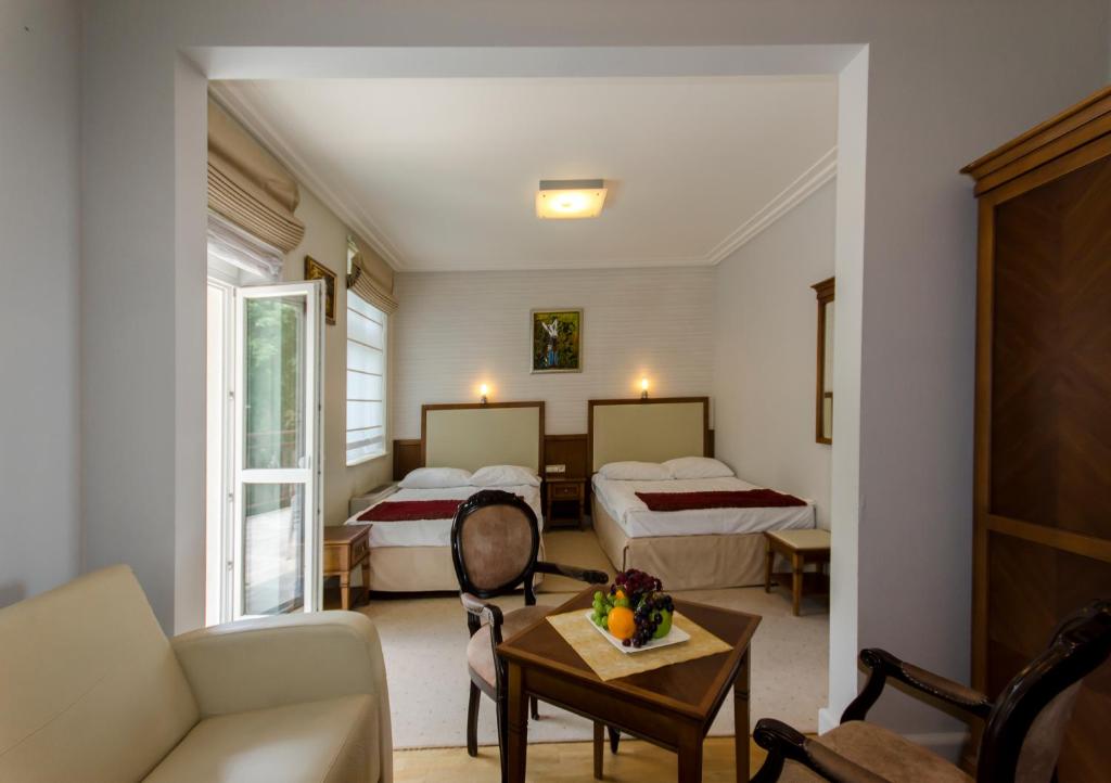 Postel nebo postele na pokoji v ubytování Hotel Apollo