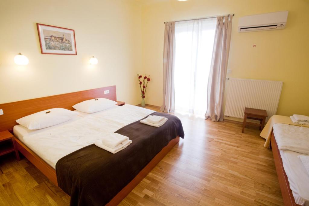 Un ou plusieurs lits dans un hébergement de l'établissement Alo Apartments Vila Klara