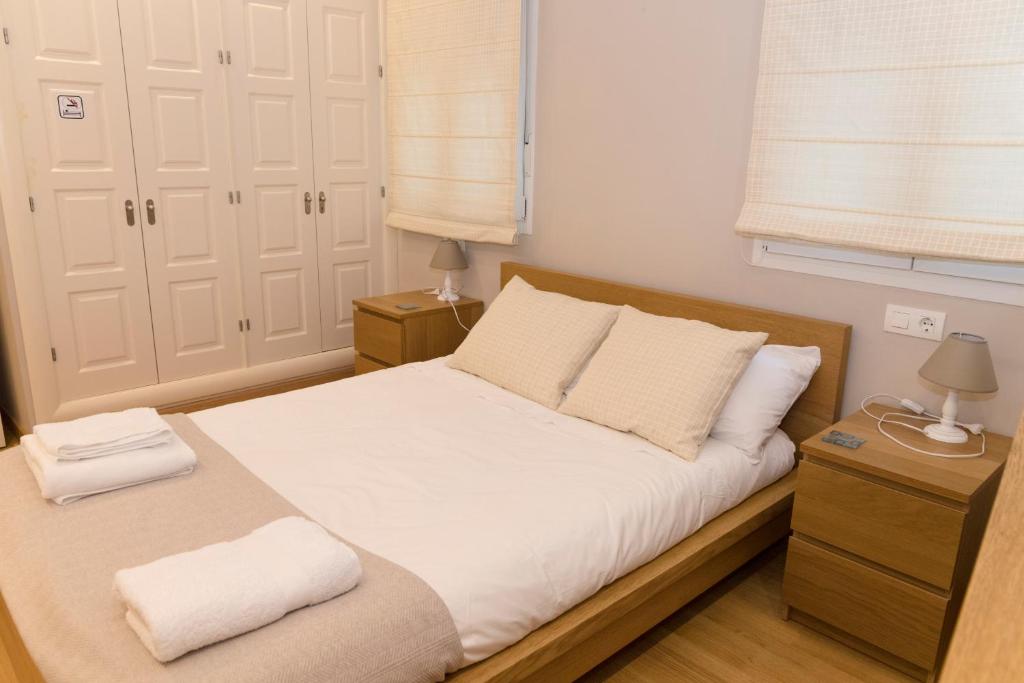 Posteľ alebo postele v izbe v ubytovaní Apartamento Melina Arlu - Centro Historico