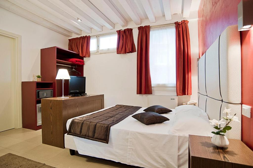 Postel nebo postele na pokoji v ubytování Al Canal Regio - Guest House