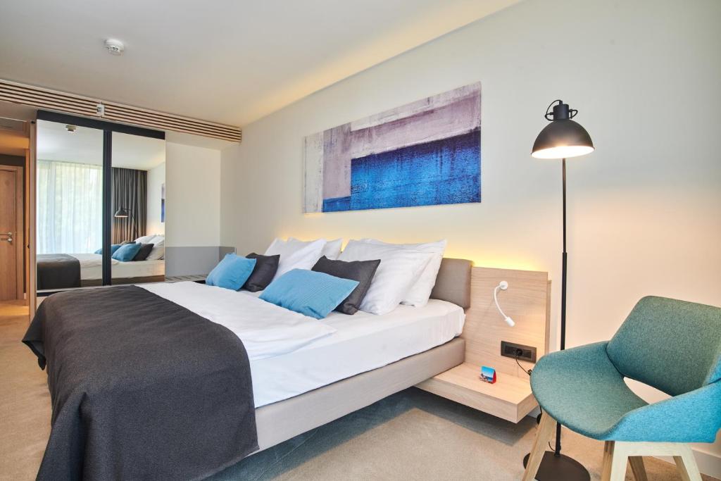 Postel nebo postele na pokoji v ubytování Hotel Park Plava Laguna