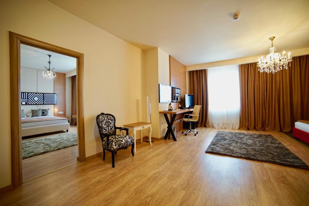 Postel nebo postele na pokoji v ubytování Astoria Hotel & SPA