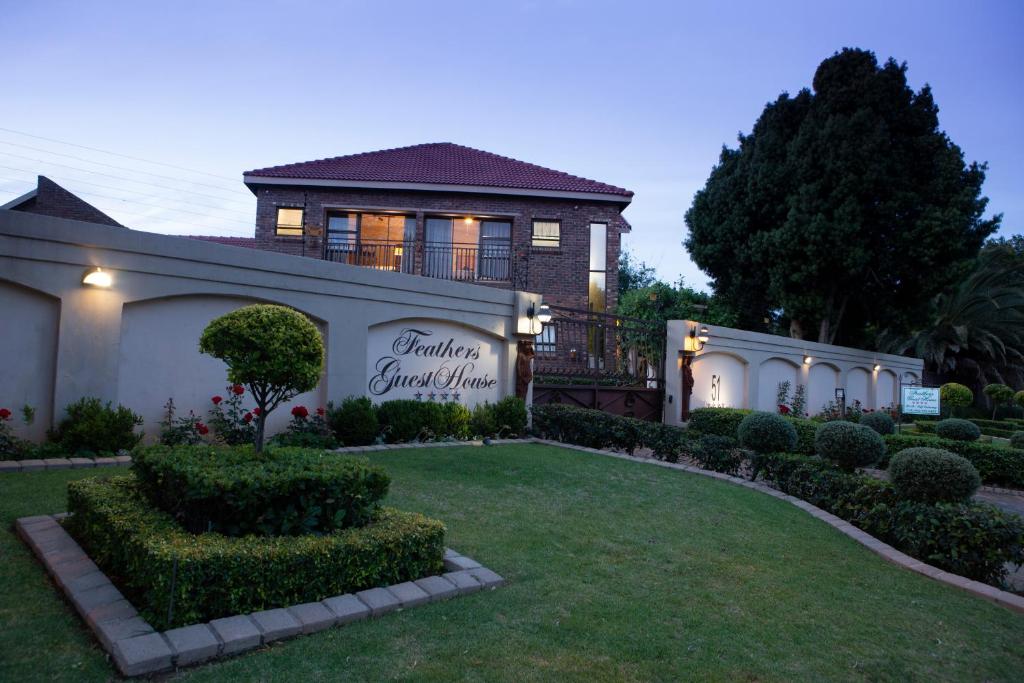 a house with a sign that reads grannis guest house at Feathers Guest House in Middelburg