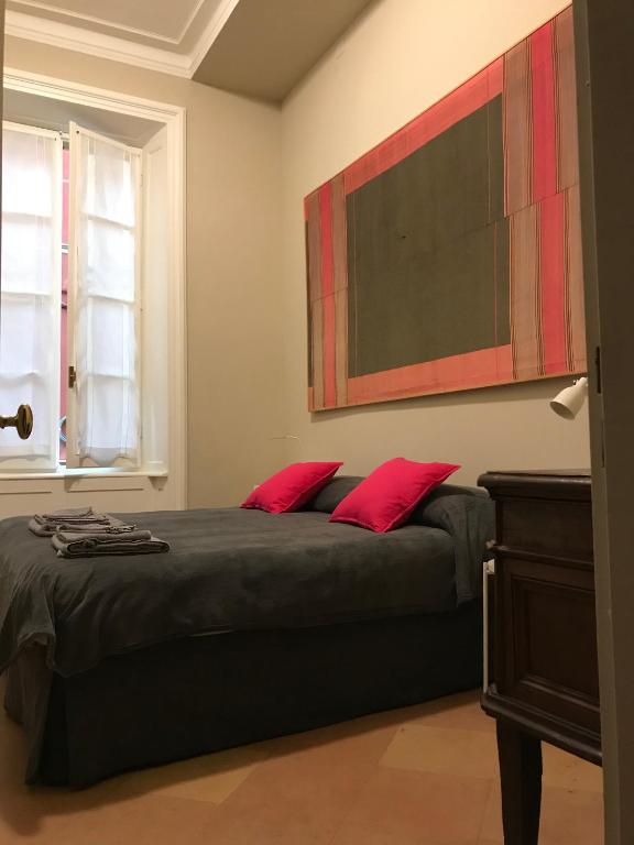 Postel nebo postele na pokoji v ubytování Luigi in Palazzo Bianchi