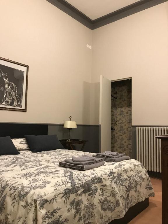 Postel nebo postele na pokoji v ubytování Luigi in Palazzo Bianchi