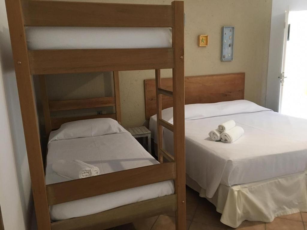 Cama ou camas em um quarto em Pousada Villa Maritima
