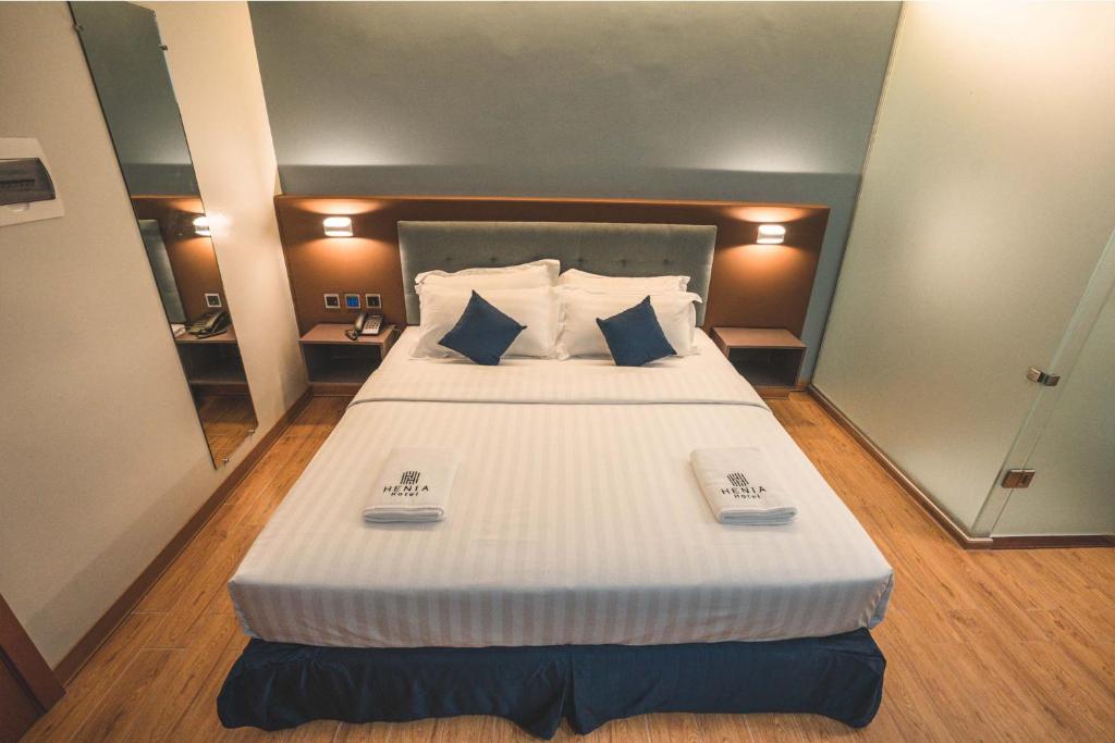 Postel nebo postele na pokoji v ubytování Henia Hotel