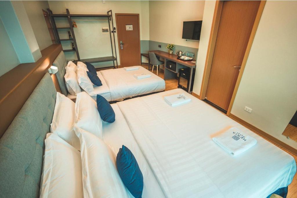 Postel nebo postele na pokoji v ubytování Henia Hotel