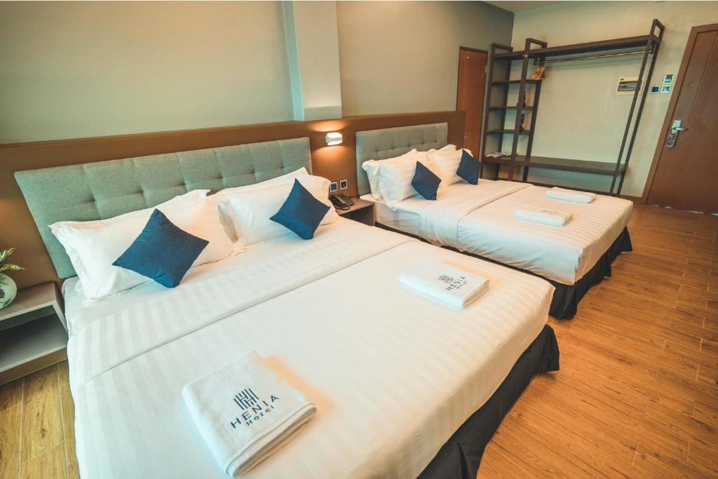 Postel nebo postele na pokoji v ubytování Henia Hotel