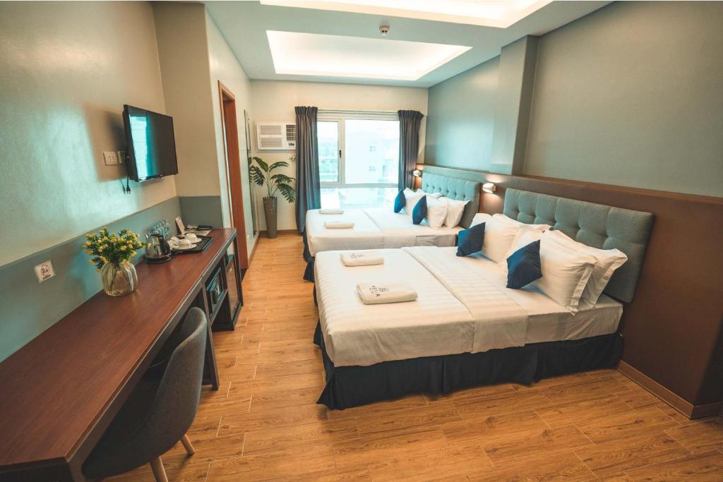Postel nebo postele na pokoji v ubytování Henia Hotel