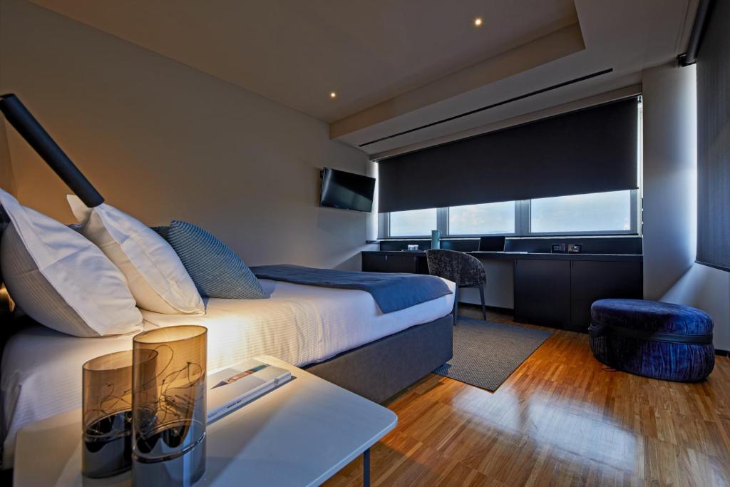 Postel nebo postele na pokoji v ubytování Delparco Hotel