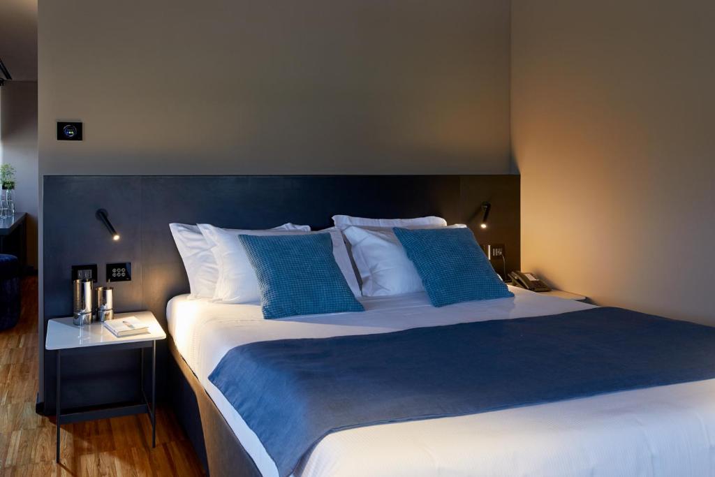 Postel nebo postele na pokoji v ubytování Delparco Hotel