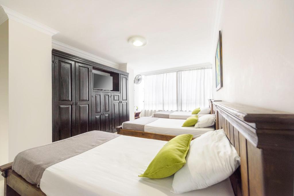 Postel nebo postele na pokoji v ubytování Ayenda 1120 Hotel Comercial
