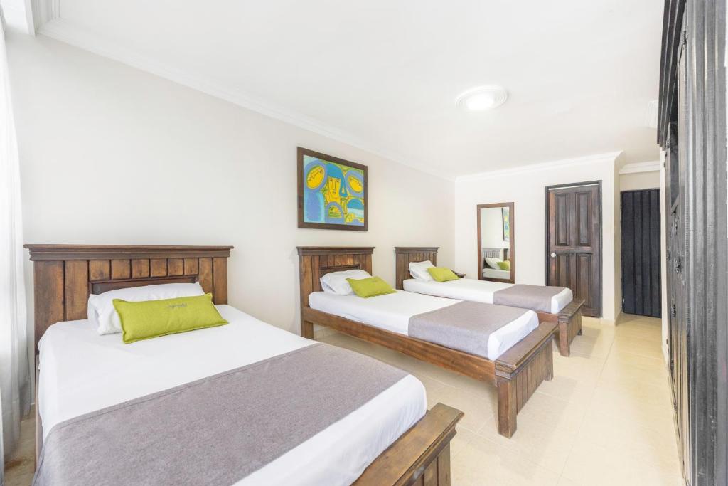 Postel nebo postele na pokoji v ubytování Ayenda 1120 Hotel Comercial