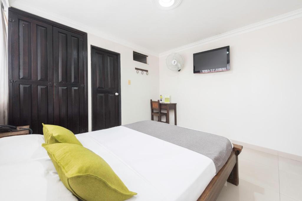 Postel nebo postele na pokoji v ubytování Ayenda 1120 Hotel Comercial