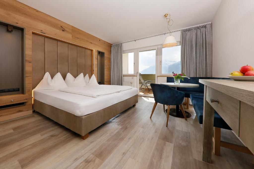 Postel nebo postele na pokoji v ubytování Family Hotel Gutenberg