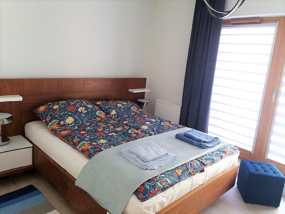 Posteľ alebo postele v izbe v ubytovaní Apartament Lukrecja