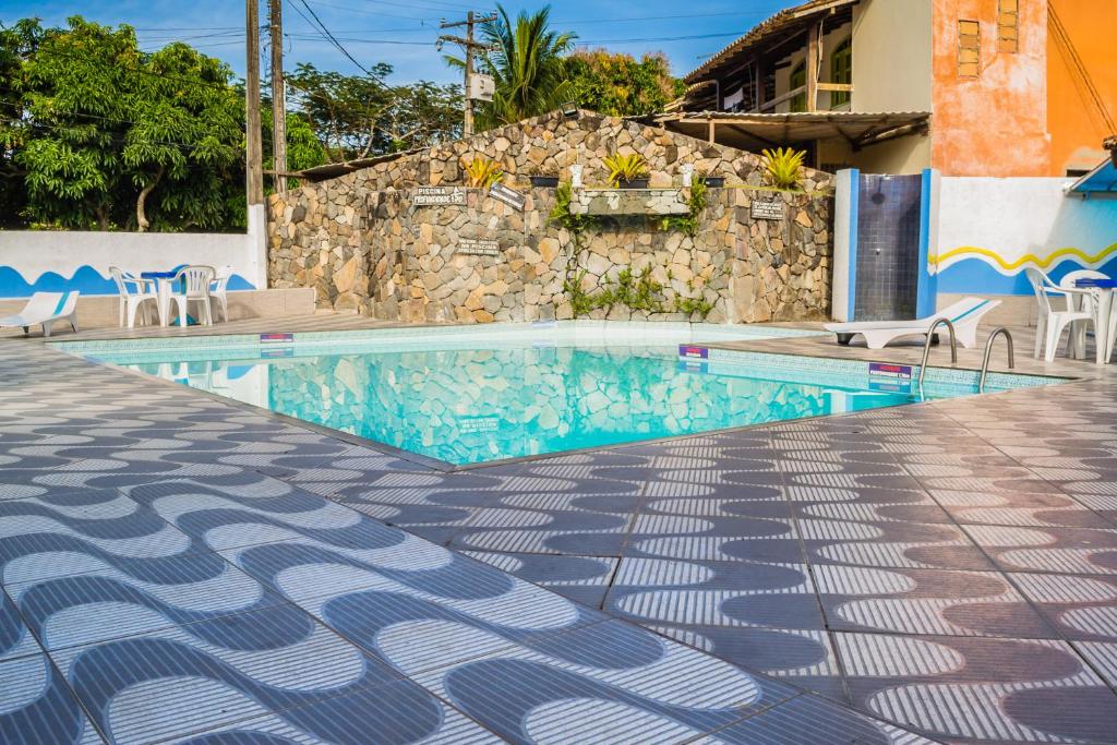 Bazén v ubytování Hotel Porto das Ancoras nebo v jeho okolí