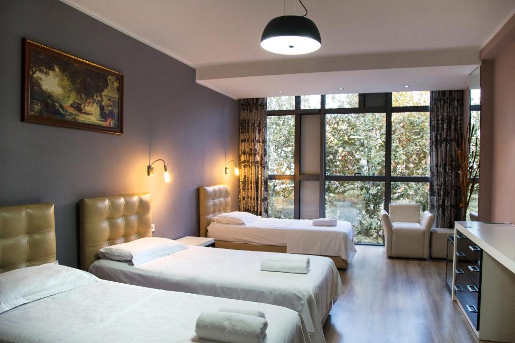 Postel nebo postele na pokoji v ubytování Hotel Relax