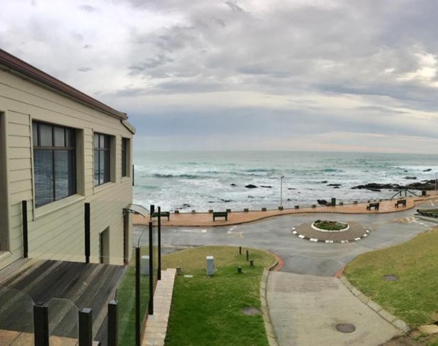 a building with a view of the ocean at Coo-ee 9 in Herolds Bay