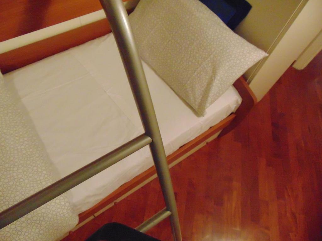 Posteľ alebo postele v izbe v ubytovaní Dante's Rooms