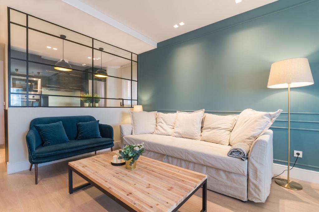 a living room with a couch and a table at COMFORT & STYLE IN MADRID!!! 3BD 2BTH+TERRACE in Madrid