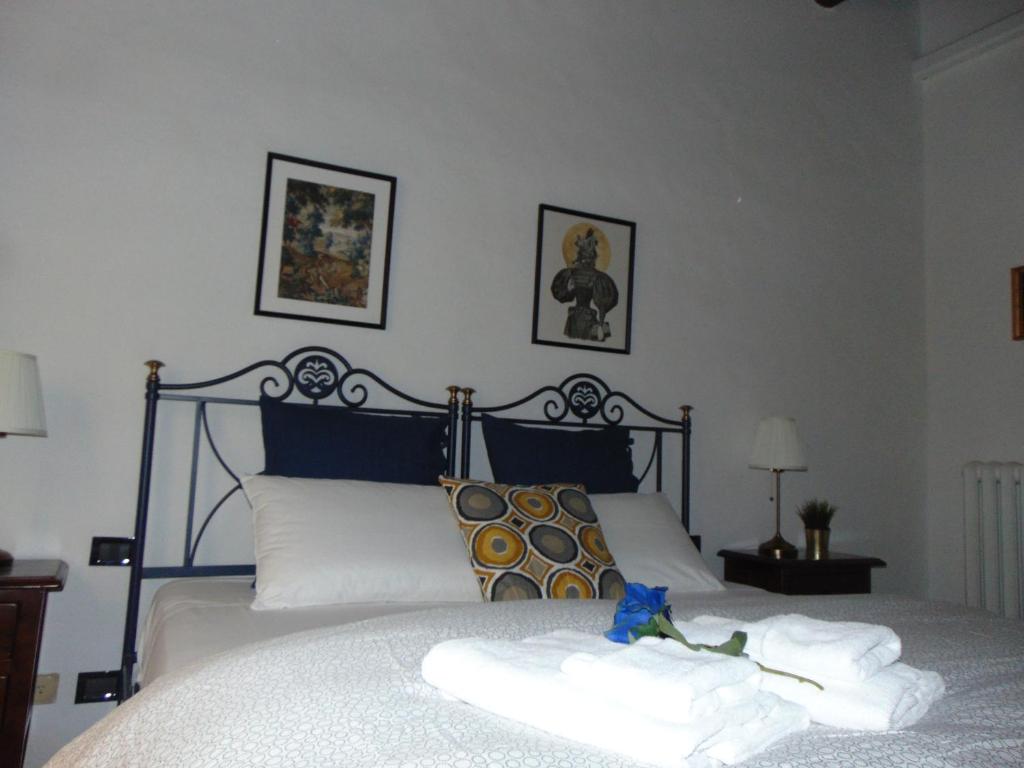 Posteľ alebo postele v izbe v ubytovaní Dante's Rooms