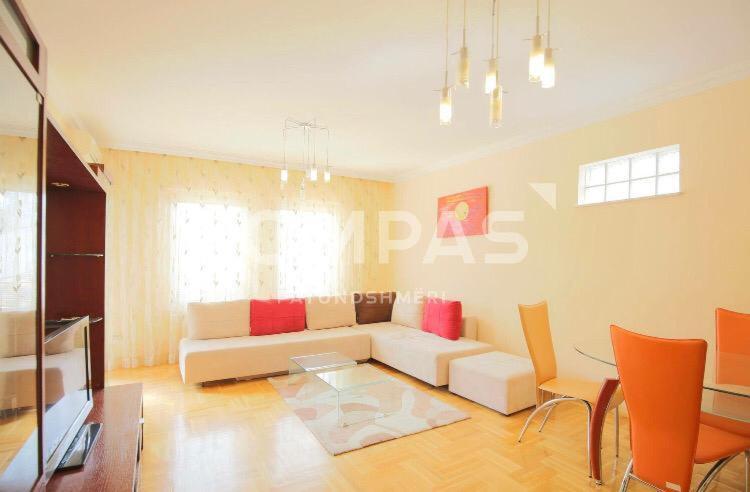 a living room with a couch and a table at Hana Apartments Prishtina in Pristina