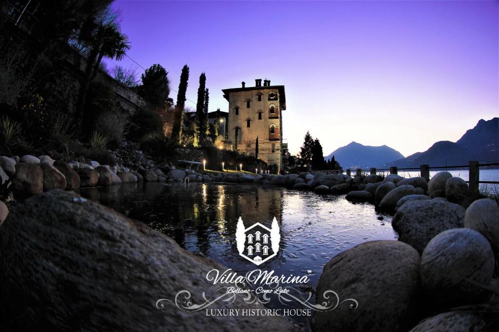 een foto van een kasteel in het midden van een rivier bij Villa Marina - Como lake in Bellano