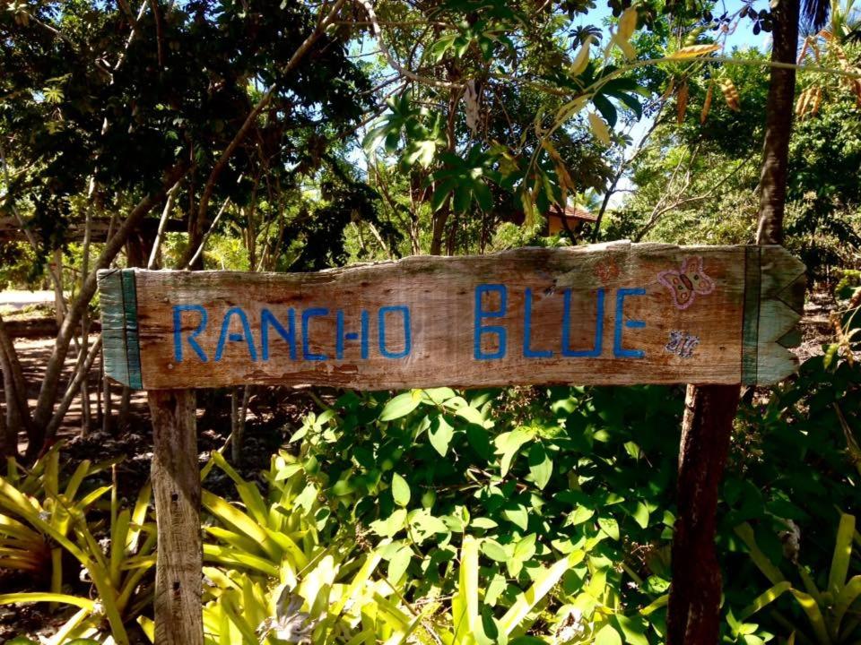 a wooden sign that says rango blue at Rancho Blue in Marau