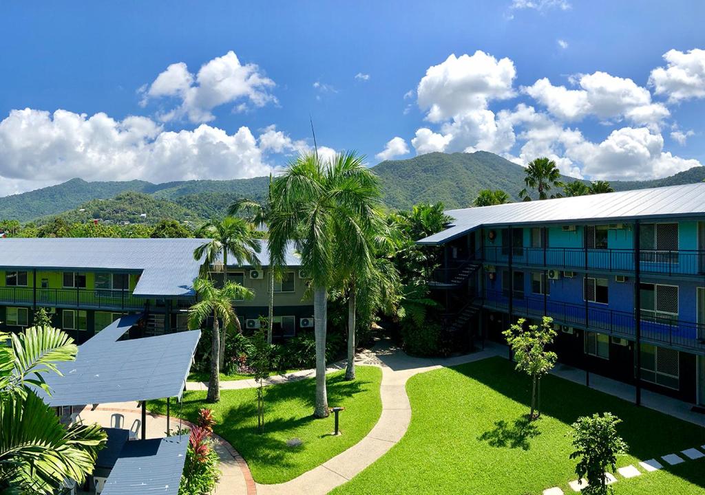 an aerial view of a resort with mountains in the background at Cairns Student Lodge - ALL meals included in Smithfield