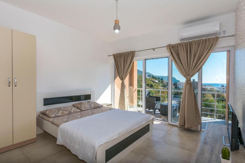 Postel nebo postele na pokoji v ubytování Apartments DILARA