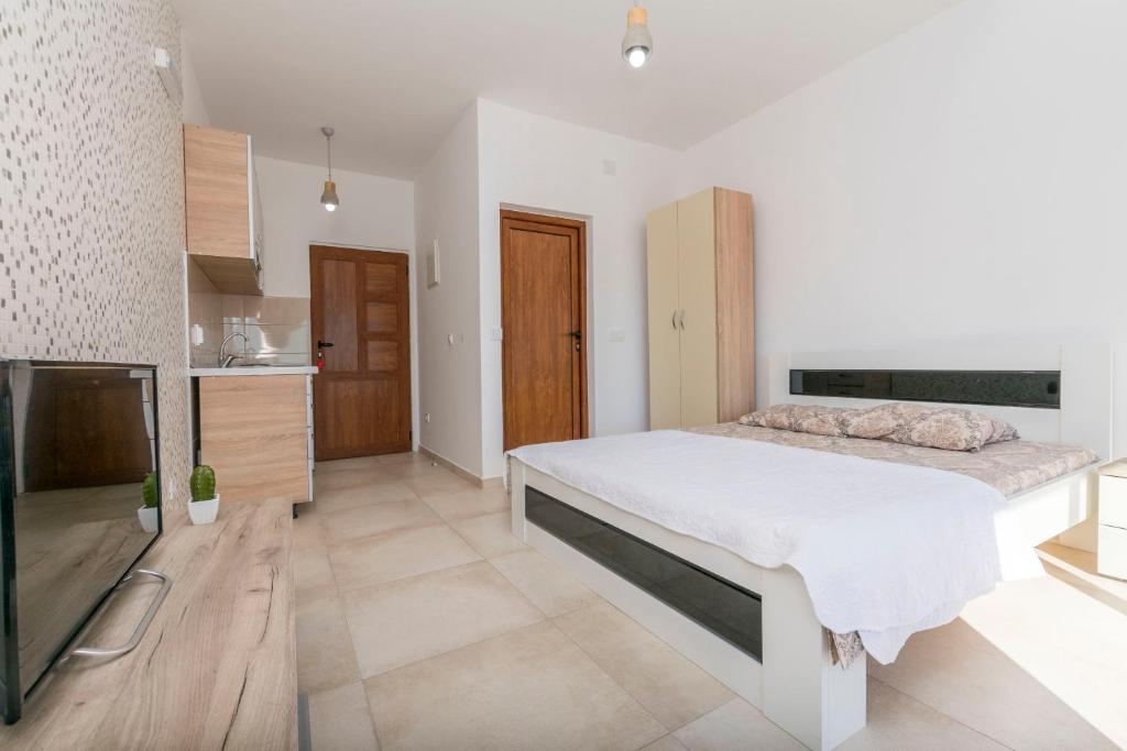 Postel nebo postele na pokoji v ubytování Apartments DILARA