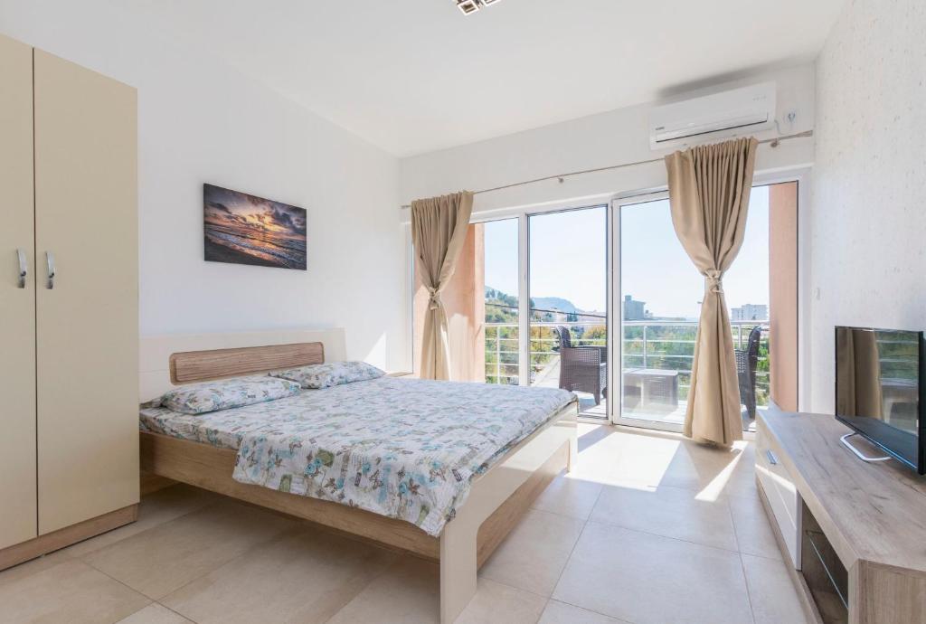 Postel nebo postele na pokoji v ubytování Apartments DILARA