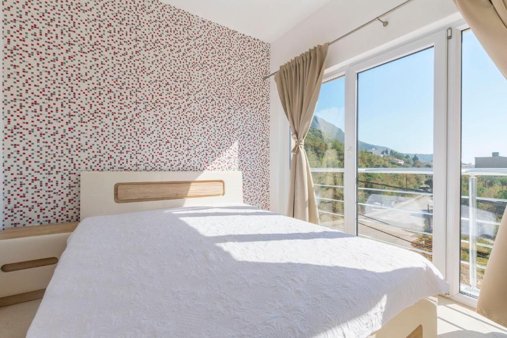 Postel nebo postele na pokoji v ubytování Apartments DILARA