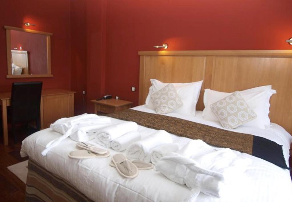 Postel nebo postele na pokoji v ubytování Hotel Mimallones