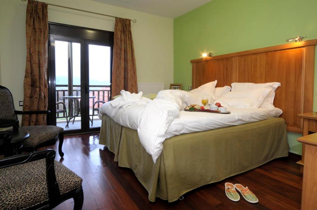 Postel nebo postele na pokoji v ubytování Hotel Mimallones