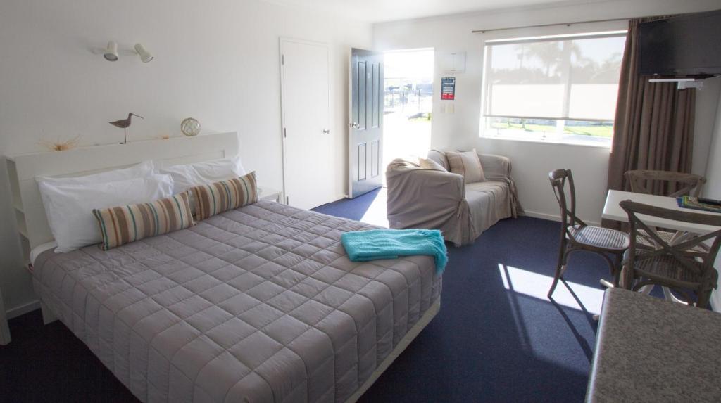 Postel nebo postele na pokoji v ubytování Motel Oasis