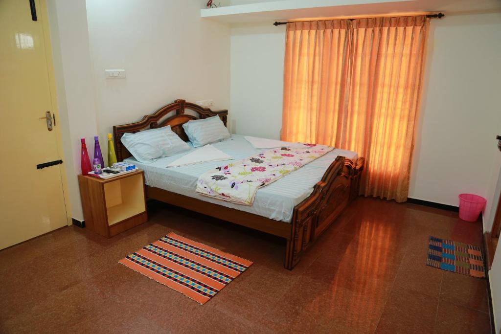Postel nebo postele na pokoji v ubytování Coimbatore Home Stay & Serviced Apartment