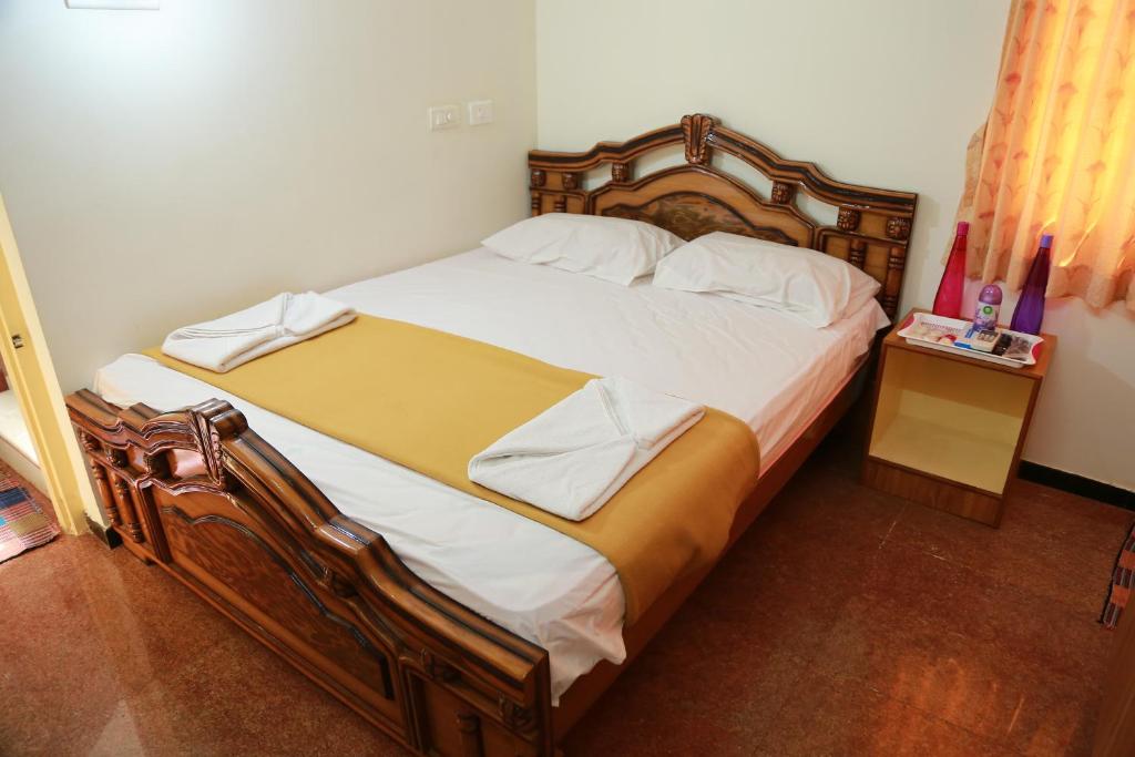 Postel nebo postele na pokoji v ubytování Coimbatore Home Stay & Serviced Apartment